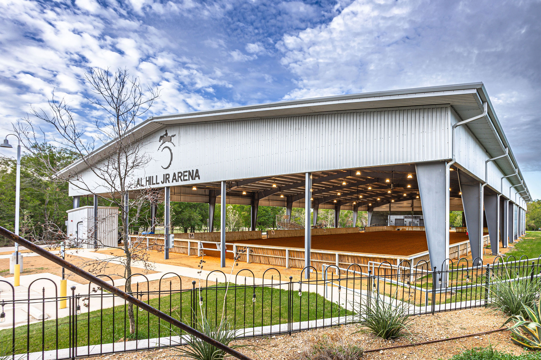 a large building with a metal fence around it