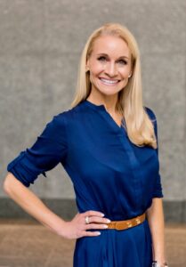 woman in a blue dress posing for a picture